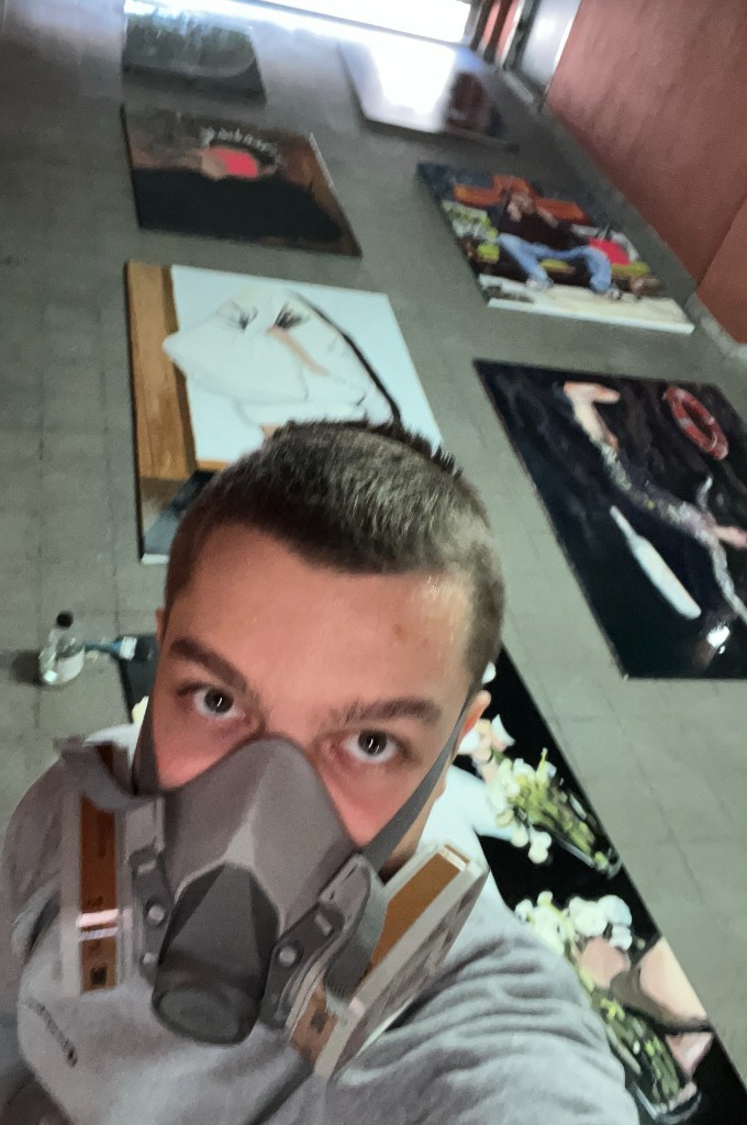 Paintings laid out in the studio before MoBU